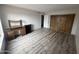 Bright bedroom with wood-look floors and mirrored closet doors at 540 N May St # 2109, Mesa, AZ 85201