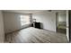 Spacious bedroom with wood-look floors and large window at 540 N May St # 2109, Mesa, AZ 85201