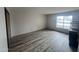 Spacious bedroom with large window and wood-look floors at 540 N May St # 2109, Mesa, AZ 85201