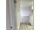 Bright hallway with wood-look floors and access to other rooms at 540 N May St # 2109, Mesa, AZ 85201