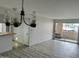Spacious living room with wood-look floors and sliding glass doors at 540 N May St # 2109, Mesa, AZ 85201