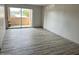 Living room with wood-look floors and access to a patio at 540 N May St # 2109, Mesa, AZ 85201