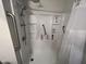 Walk-in shower with grab bars and built-in shelving at 540 N May St # 2109, Mesa, AZ 85201
