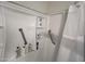 Walk-in shower with grab bars and built-in shelving at 540 N May St # 2109, Mesa, AZ 85201