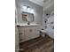 Updated bathroom with modern vanity, sleek fixtures, and stylish tile work at 5738 N 68Th Ave, Glendale, AZ 85303