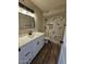 Modern bathroom featuring white vanity, updated fixtures, and tile shower at 5738 N 68Th Ave, Glendale, AZ 85303