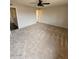 Large bedroom with ceiling fan and neutral carpet at 5738 N 68Th Ave, Glendale, AZ 85303