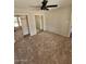 Spacious bedroom features a ceiling fan and large mirrored closet doors at 5738 N 68Th Ave, Glendale, AZ 85303
