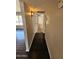 Hallway with wood-look floors and fresh paint at 5738 N 68Th Ave, Glendale, AZ 85303