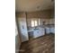 Bright updated kitchen featuring white cabinets and a modern sink at 5738 N 68Th Ave, Glendale, AZ 85303
