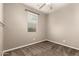 A carpeted bedroom with a window, a ceiling fan, and neutral walls at 14859 W Surrey Dr, Surprise, AZ 85379