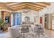 Open concept living room with beamed ceilings, a decorative cabinet, and neutral decor at 6240 N 59Th Pl, Paradise Valley, AZ 85253