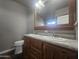 Bathroom with double vanity, large mirror, and updated fixtures at 650 N Hawes Rd # 3729, Mesa, AZ 85207