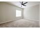 Spacious bedroom with ceiling fan and neutral carpeting at 2696 N 162Nd Ln, Goodyear, AZ 85395