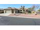 Single-story home with a two-car garage and landscaped yard at 2696 N 162Nd Ln, Goodyear, AZ 85395