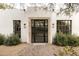 Modern front door with sidelights and brick walkway at 12801 N 65Th Pl, Scottsdale, AZ 85254