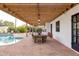 Covered patio with dining table and pool view at 12801 N 65Th Pl, Scottsdale, AZ 85254