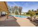 Relaxing pool area with pergola and patio furniture at 12801 N 65Th Pl, Scottsdale, AZ 85254