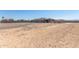 Large lot with rear covered patio and unfinished desert landscape at 13524 W Sierra Vista Dr, Glendale, AZ 85307