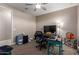 Bedroom with a ceiling fan, blue plastic storage container, and a work desk at 13524 W Sierra Vista Dr, Glendale, AZ 85307