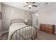 Neutral bedroom with carpet flooring and a brass bed frame at 13524 W Sierra Vista Dr, Glendale, AZ 85307