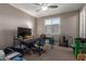 Bedroom with a ceiling fan, a window with blinds, and music accessories at 13524 W Sierra Vista Dr, Glendale, AZ 85307