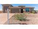 Gorgeous home with a three-car garage, desert landscaping and an attractive front entry at 13524 W Sierra Vista Dr, Glendale, AZ 85307