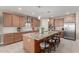 Kitchen featuring a large island with seating and stainless steel appliances at 13524 W Sierra Vista Dr, Glendale, AZ 85307