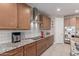 Modern kitchen with granite countertops, stainless appliances, and light wood cabinetry at 13524 W Sierra Vista Dr, Glendale, AZ 85307