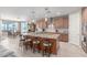Open kitchen with a large center island, pendant lighting, and modern appliances at 13524 W Sierra Vista Dr, Glendale, AZ 85307