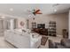 Spacious living room with a ceiling fan, tile floors, and lots of natural light at 13524 W Sierra Vista Dr, Glendale, AZ 85307