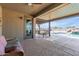 Outdoor patio with table, chairs, ceiling fan, and view of the beautiful pool at 13524 W Sierra Vista Dr, Glendale, AZ 85307