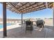 Outdoor patio with pergola covering dining area, view of pool and desert landscape at 13524 W Sierra Vista Dr, Glendale, AZ 85307
