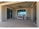 Covered outdoor patio featuring a ceiling fan, furniture, and views of the pool at 13524 W Sierra Vista Dr, Glendale, AZ 85307