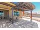 Extended covered patio with outdoor dining and relaxation area at 13524 W Sierra Vista Dr, Glendale, AZ 85307