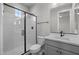 Clean bathroom with gray vanity, toilet and a glass shower door at 2233 W Hide Trl, Phoenix, AZ 85085