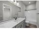 Modern bathroom featuring a shower/tub combo and gray vanity at 2233 W Hide Trl, Phoenix, AZ 85085