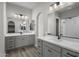 Modern bathroom with gray double vanity and a walk-in shower at 2233 W Hide Trl, Phoenix, AZ 85085