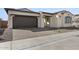 One-story home with brown garage door and landscaping at 2233 W Hide Trl, Phoenix, AZ 85085