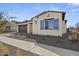 Charming house with blue shutters and well-manicured landscaping at 2233 W Hide Trl, Phoenix, AZ 85085