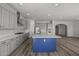 Modern kitchen with gray cabinets, white quartz countertops and a blue island at 2233 W Hide Trl, Phoenix, AZ 85085