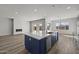 Modern kitchen with gray cabinets, white quartz countertops and a blue island at 2233 W Hide Trl, Phoenix, AZ 85085