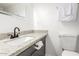 Bathroom featuring a sleek vanity with granite countertop and modern fixtures at 2608 W Berridge Ln # 220, Phoenix, AZ 85017