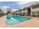 Inviting community pool surrounded by well-maintained landscaping, perfect for relaxing and socializing at 2608 W Berridge Ln # 220, Phoenix, AZ 85017