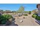 Landscaped backyard with brick pavers, gravel, and mountain views at 27174 N 85Th Dr, Peoria, AZ 85383