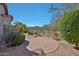 Landscaped backyard with brick pavers, gravel, and mountain views at 27174 N 85Th Dr, Peoria, AZ 85383