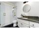 Modern bathroom with a glass shower and granite countertop at 10413 N 118Th Pl, Scottsdale, AZ 85259