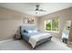 Cozy bedroom with a queen-size bed and ample natural light at 10413 N 118Th Pl, Scottsdale, AZ 85259