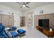 Common area with blue chairs and a TV at 10413 N 118Th Pl, Scottsdale, AZ 85259