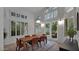 Elegant dining room with hardwood floors and sliding glass doors to patio at 10413 N 118Th Pl, Scottsdale, AZ 85259